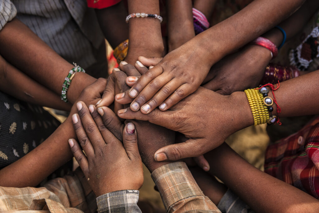 Children's hands in one of Indian villages showing unity.